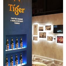 Bridging Design and Conservation: Tiger Awareness Exhibition in Singapore. Studio Königshausen showcases the brand's innovative approach—using thermochromic ink on limited edition cans to make the iconic tiger reappear when chilled.